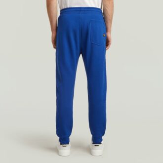 Pantaloni de trening cu grafică și logo multiplu
